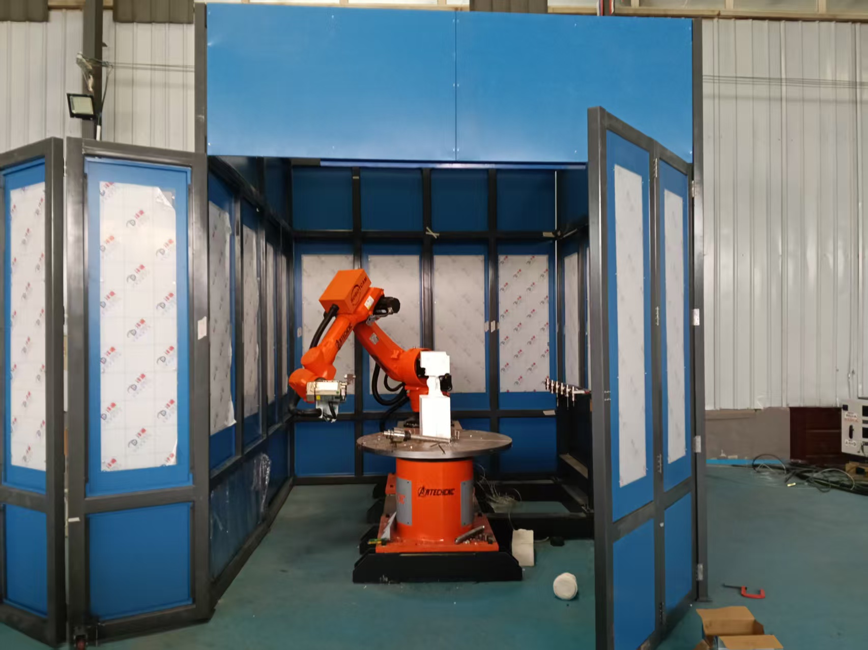 Safety Empowered, Craftsmanship Guarded! ARTECH Cnc Equips Milling Robot Arms with Safety Enclosures to Fortify Production Safety for Customers